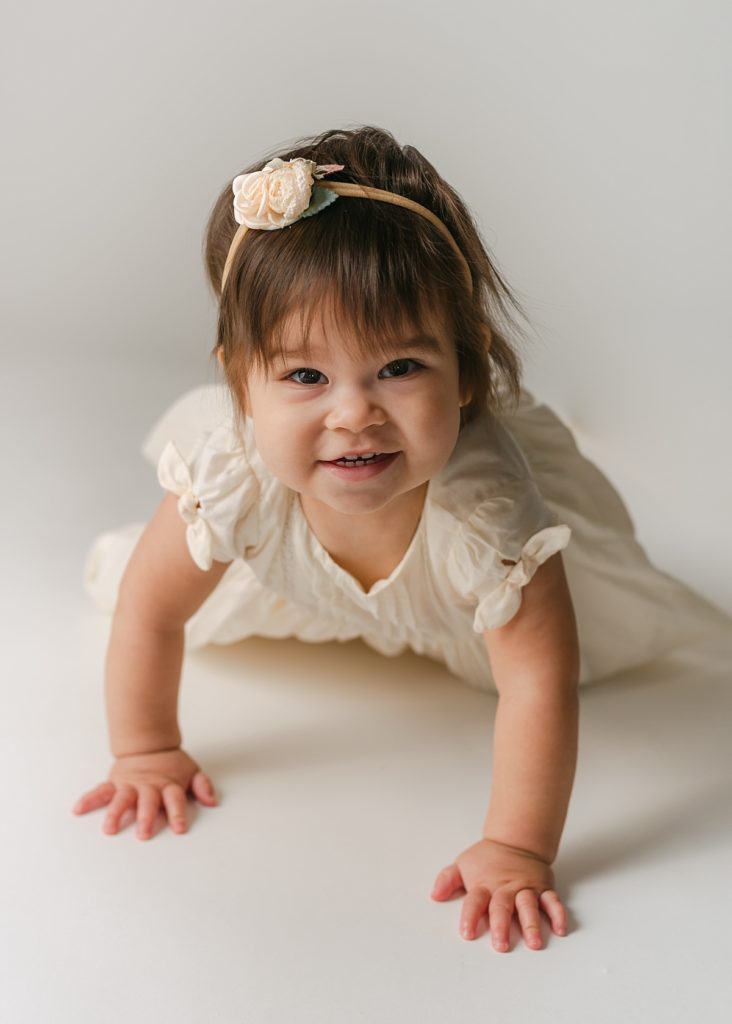 Smiling one year old girl portrait