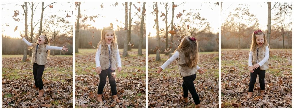 Little girl playing in the leaves in green Ohio